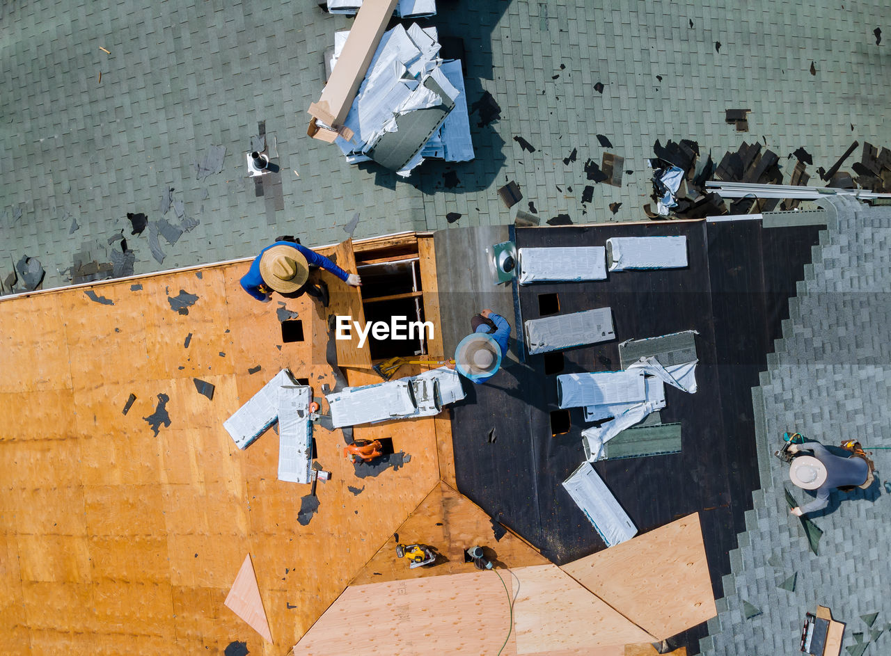 Directly above shot of people working on roof top