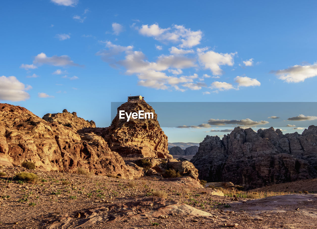 Rock formations on landscape against sky