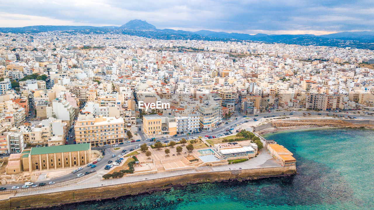 HIGH ANGLE VIEW OF CITY BUILDINGS AGAINST SKY