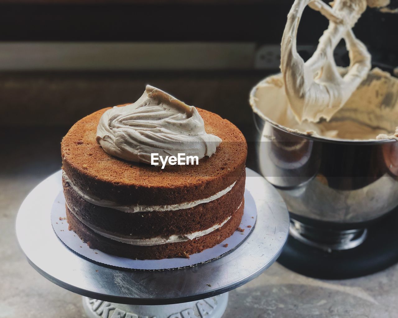 Close-up process photo of chocolate cake on table 