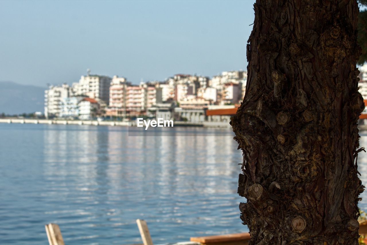 BUILDINGS BY SEA AGAINST SKY