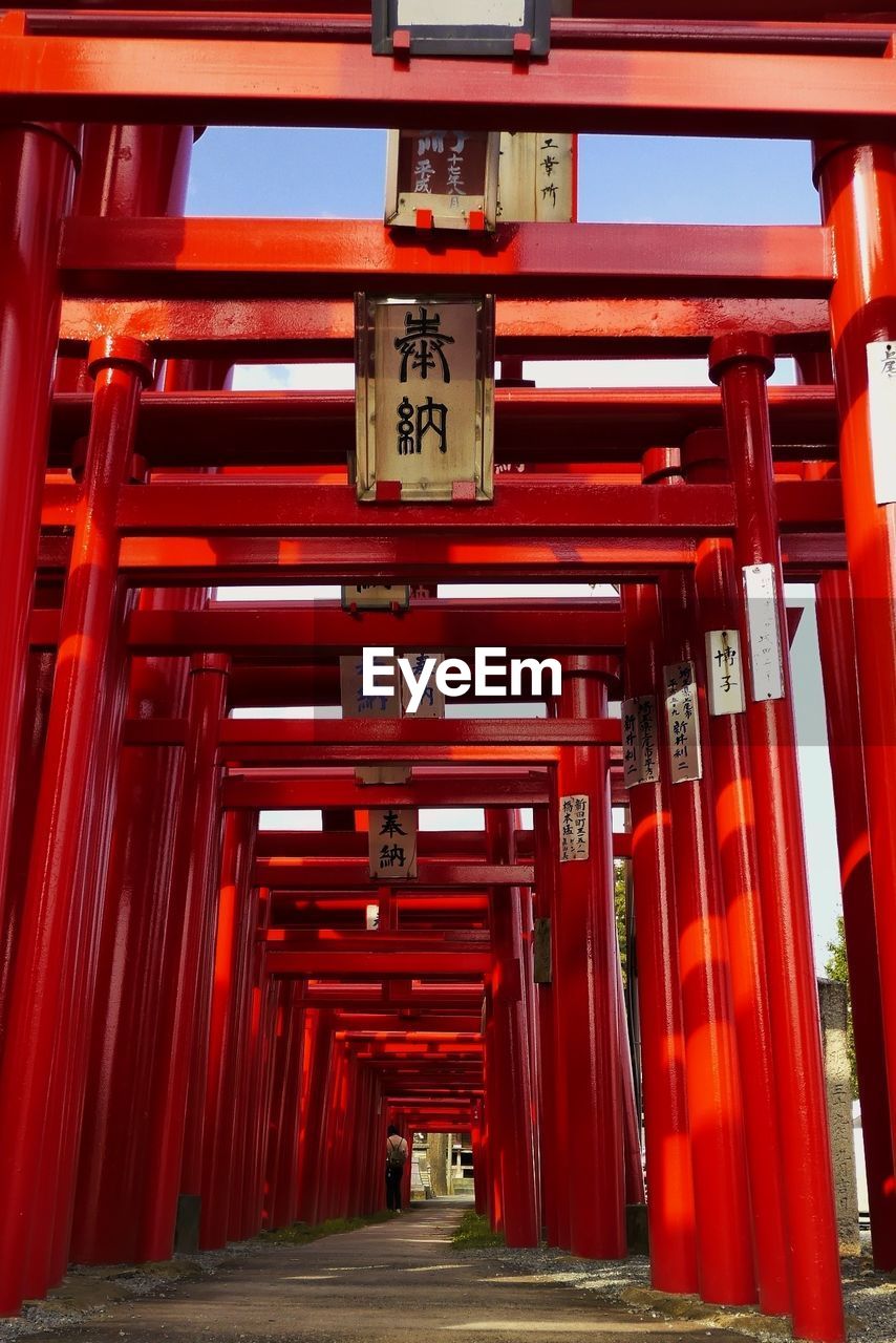 LOW ANGLE VIEW OF RED LANTERNS HANGING ON FOOTPATH