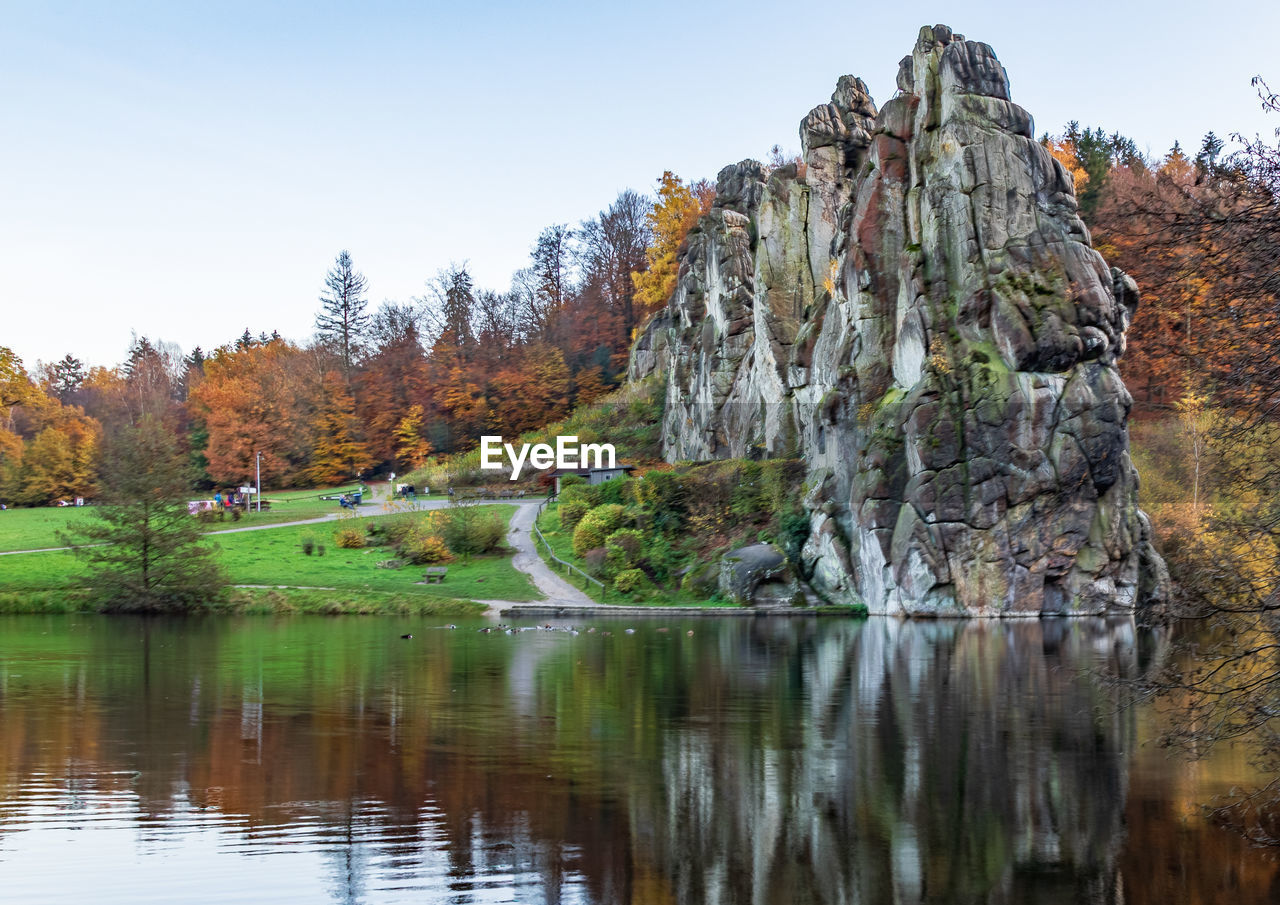 Scenic view of lake against clear sky during autumn