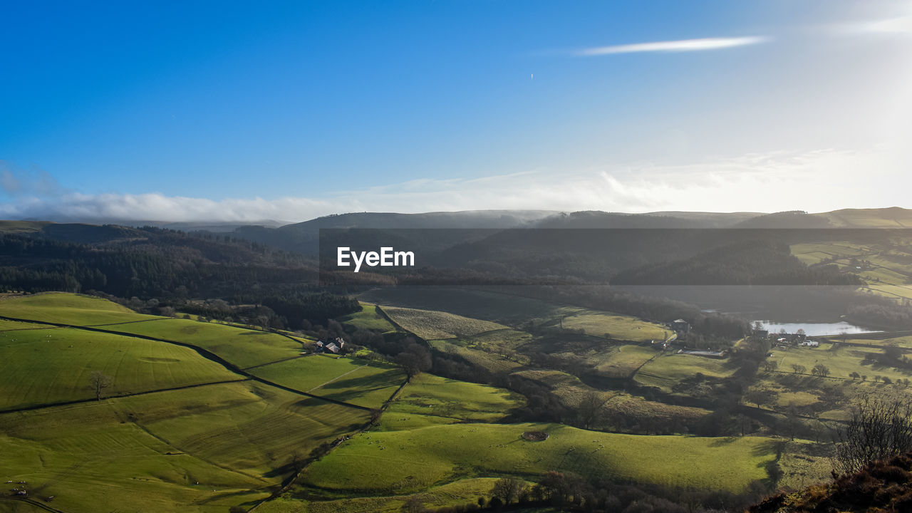 environment, landscape, scenics - nature, land, rural scene, sky, beauty in nature, mountain, nature, field, agriculture, mountain range, tranquility, plant, sunlight, tranquil scene, farm, valley, no people, cloud, crop, morning, travel, sun, green, aerial photography, outdoors, tree, idyllic, blue, plateau, sunbeam, fog, non-urban scene, summer, environmental conservation, social issues, forest, day, rural area, high angle view, travel destinations, growth, building, architecture, sunrise, grass, terrace, tourism