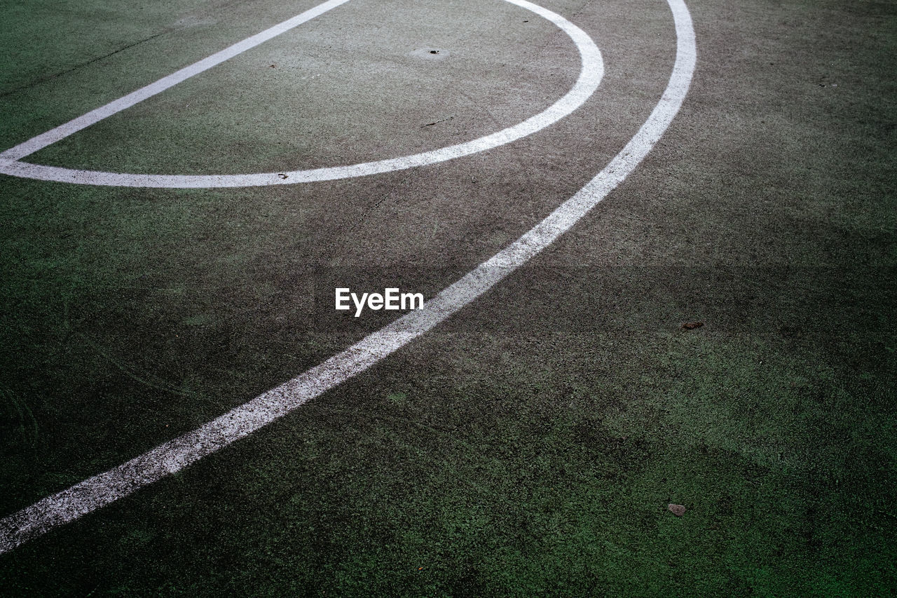 White lines on green basketball court