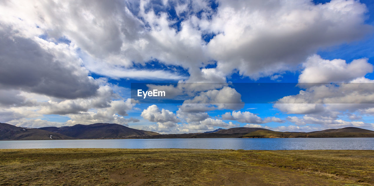 PANORAMIC VIEW OF SEA AND LAND AGAINST SKY