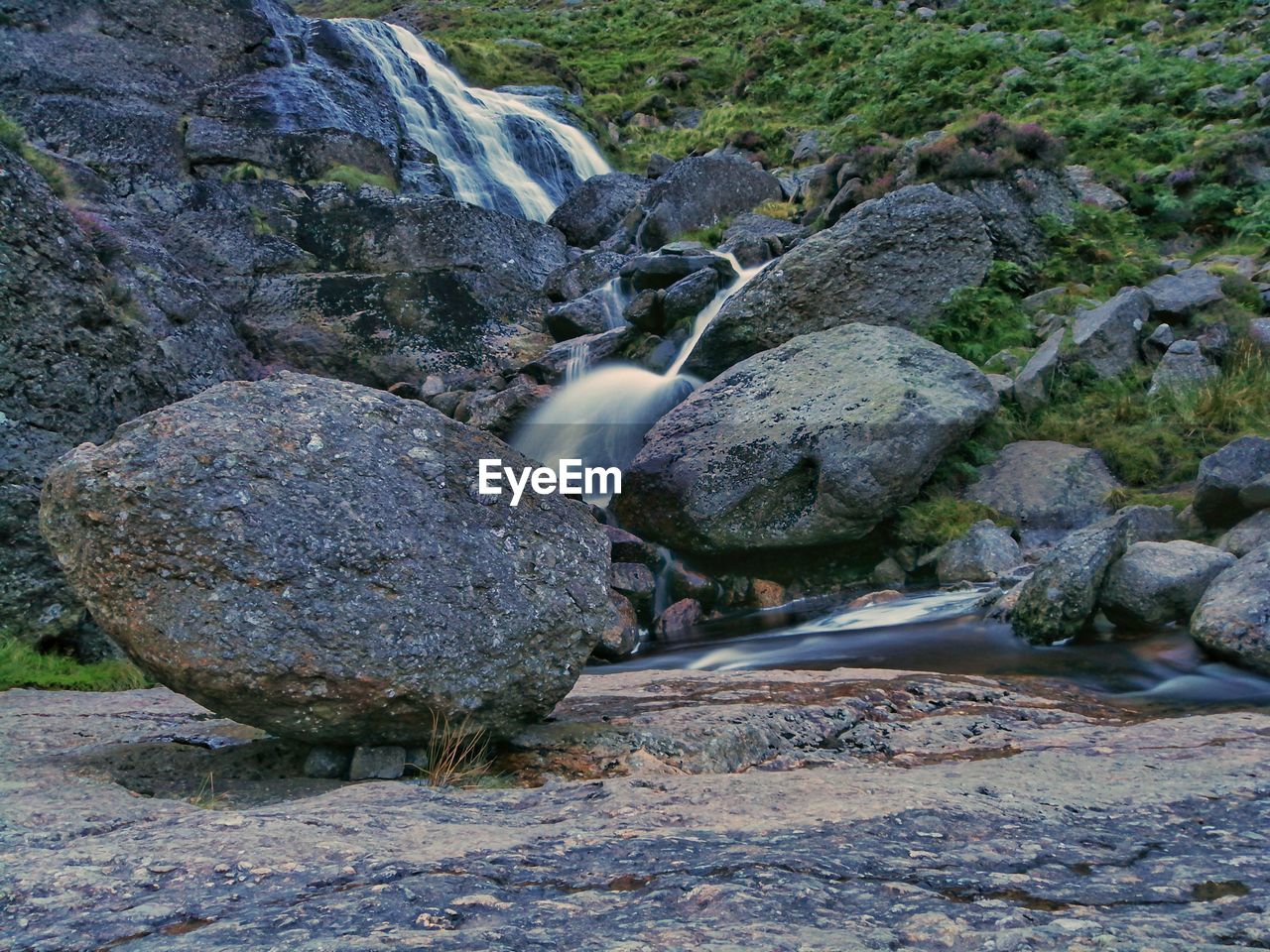 RIVER FLOWING AMIDST ROCKS