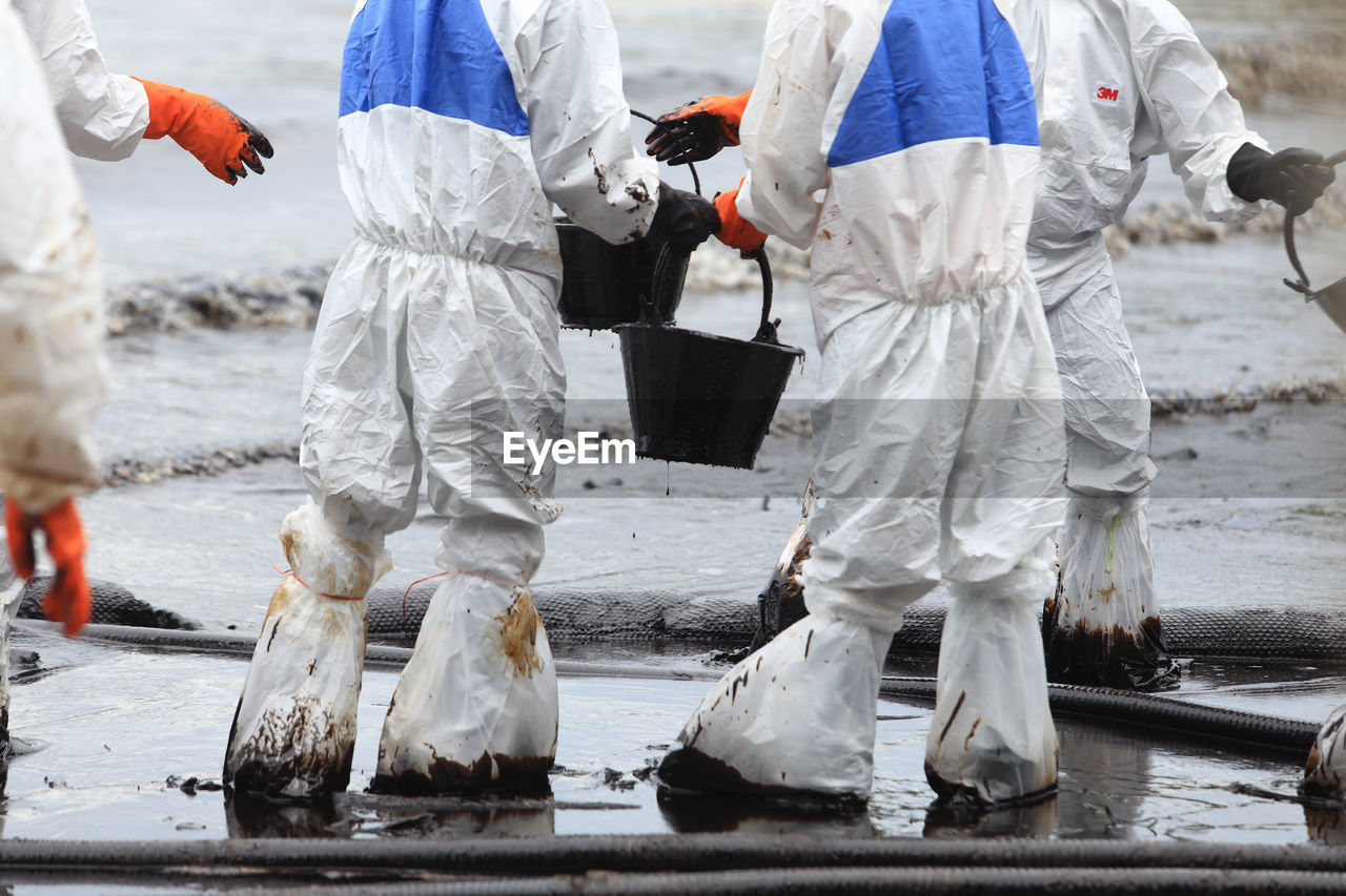 Manual workers working in dirty water