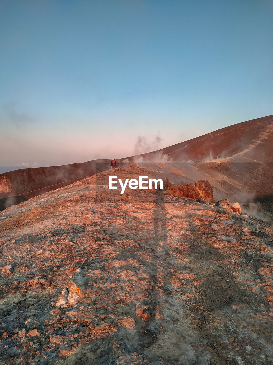 Scenic view of volcanic crater against sky