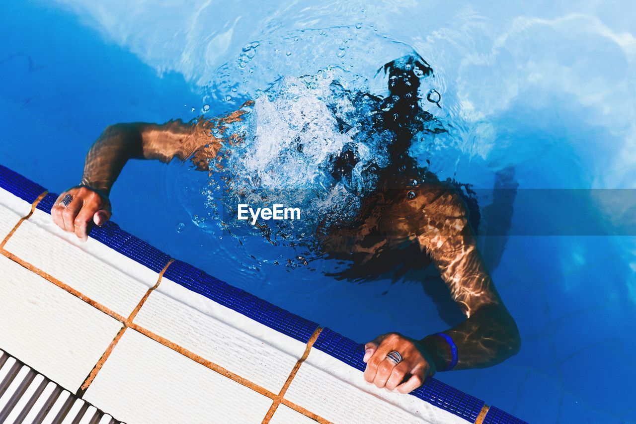 Man swimming in pool