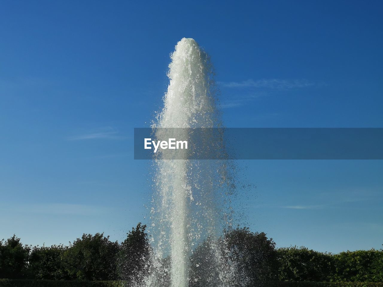 LOW ANGLE VIEW OF FOUNTAIN AGAINST BLUE SKY