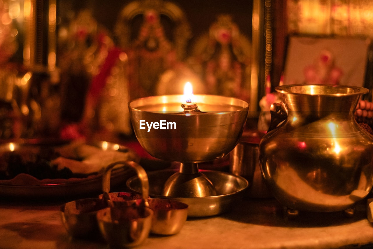 Close-up of illuminated traditional indian oil lamp 'diya'