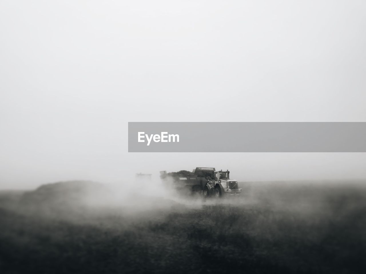 VIEW OF FOGGY FIELD AGAINST SKY