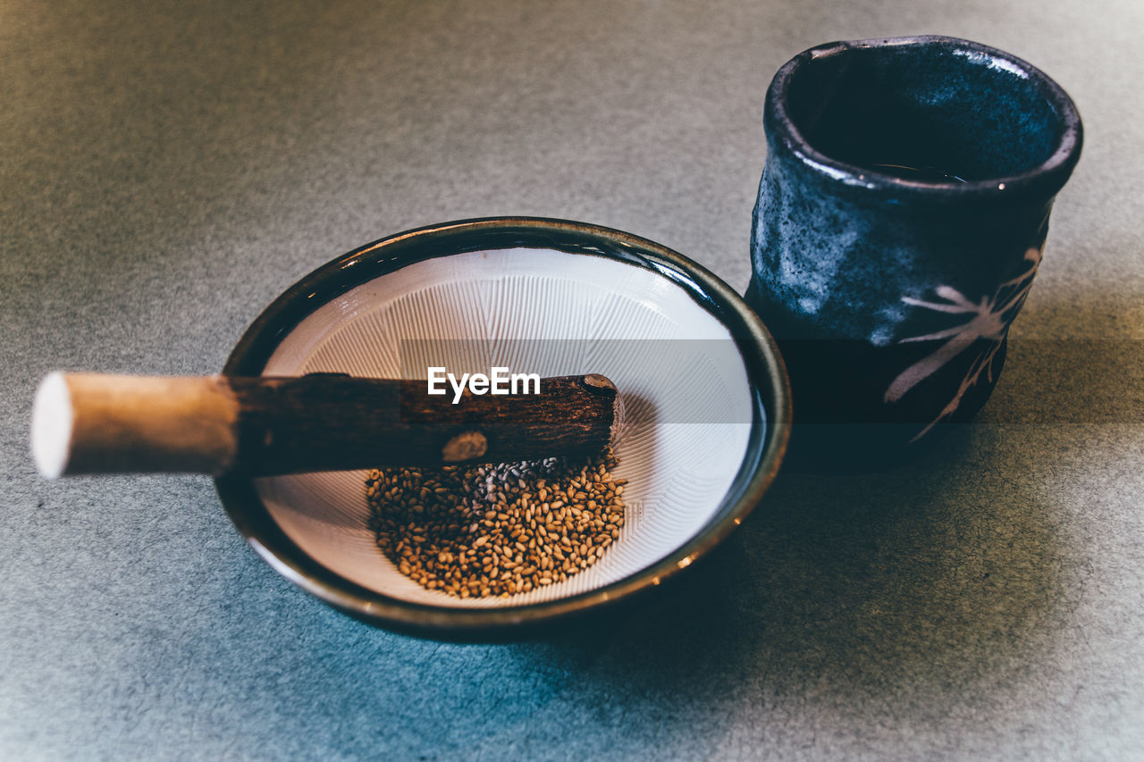 Close-up of spices in mortar and pestle on table