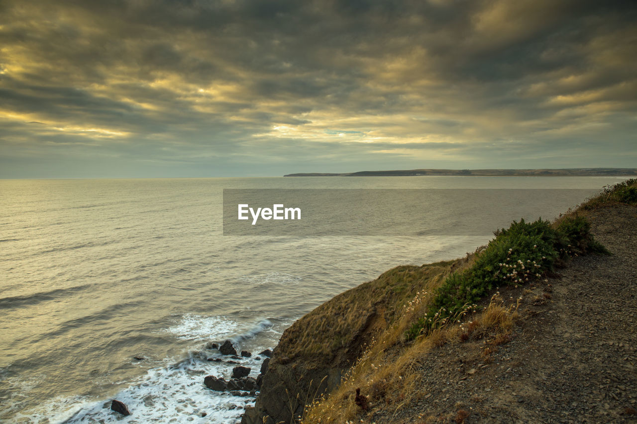SCENIC VIEW OF SEA DURING SUNSET