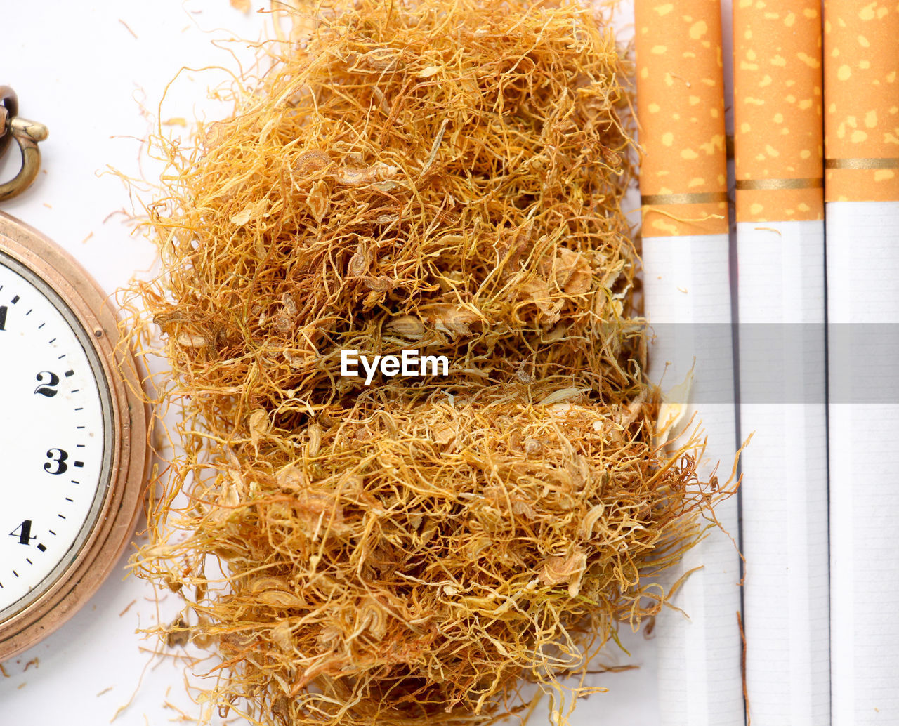 Close-up of cigarettes over white background