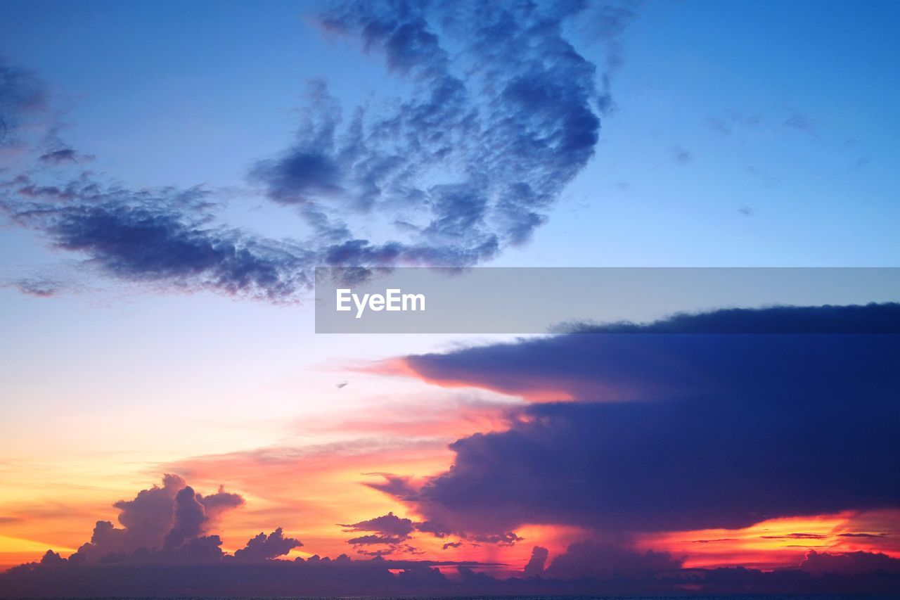 Low angle view of clouds in sky during sunset