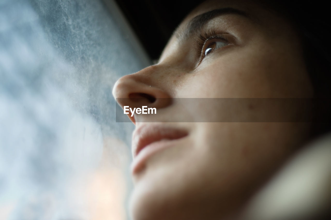 Low angle view of young woman's face