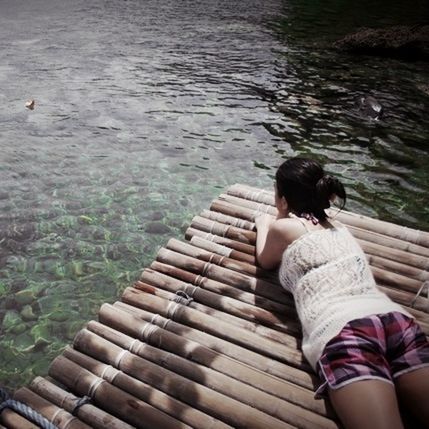 PEOPLE RELAXING IN WATER