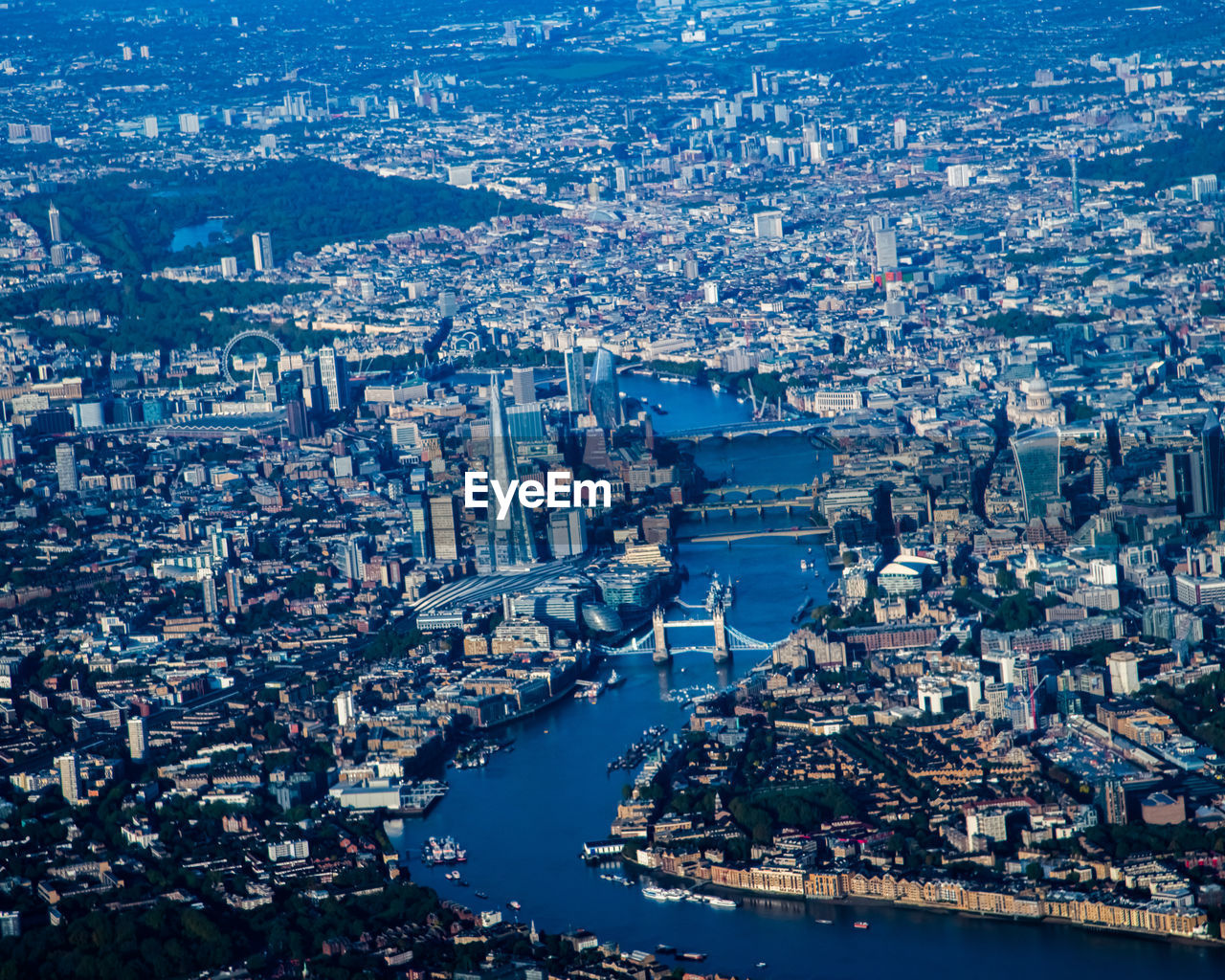 HIGH ANGLE VIEW OF ILLUMINATED CITY BUILDINGS