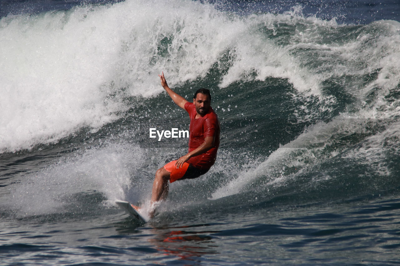 MAN SPLASHING WATER