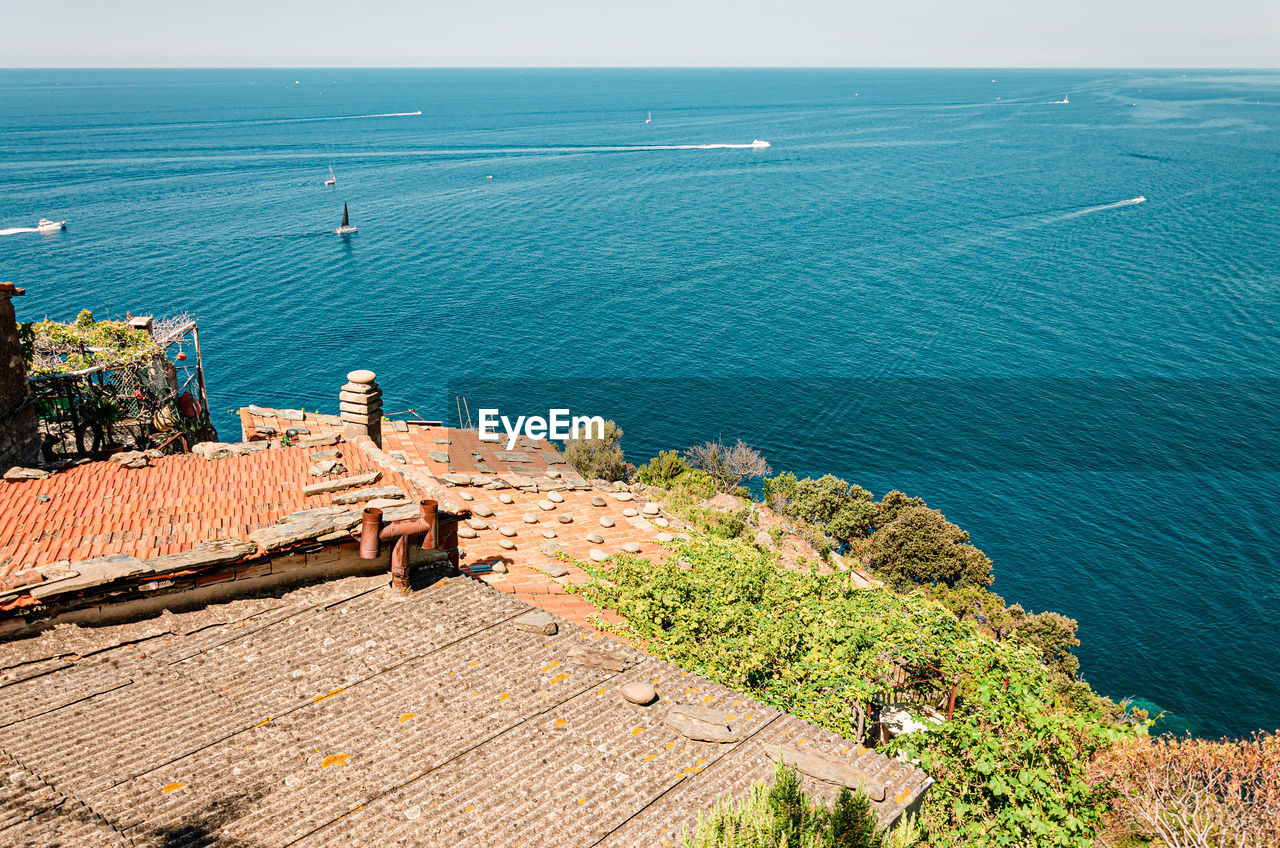 High angle view of building by sea against sky