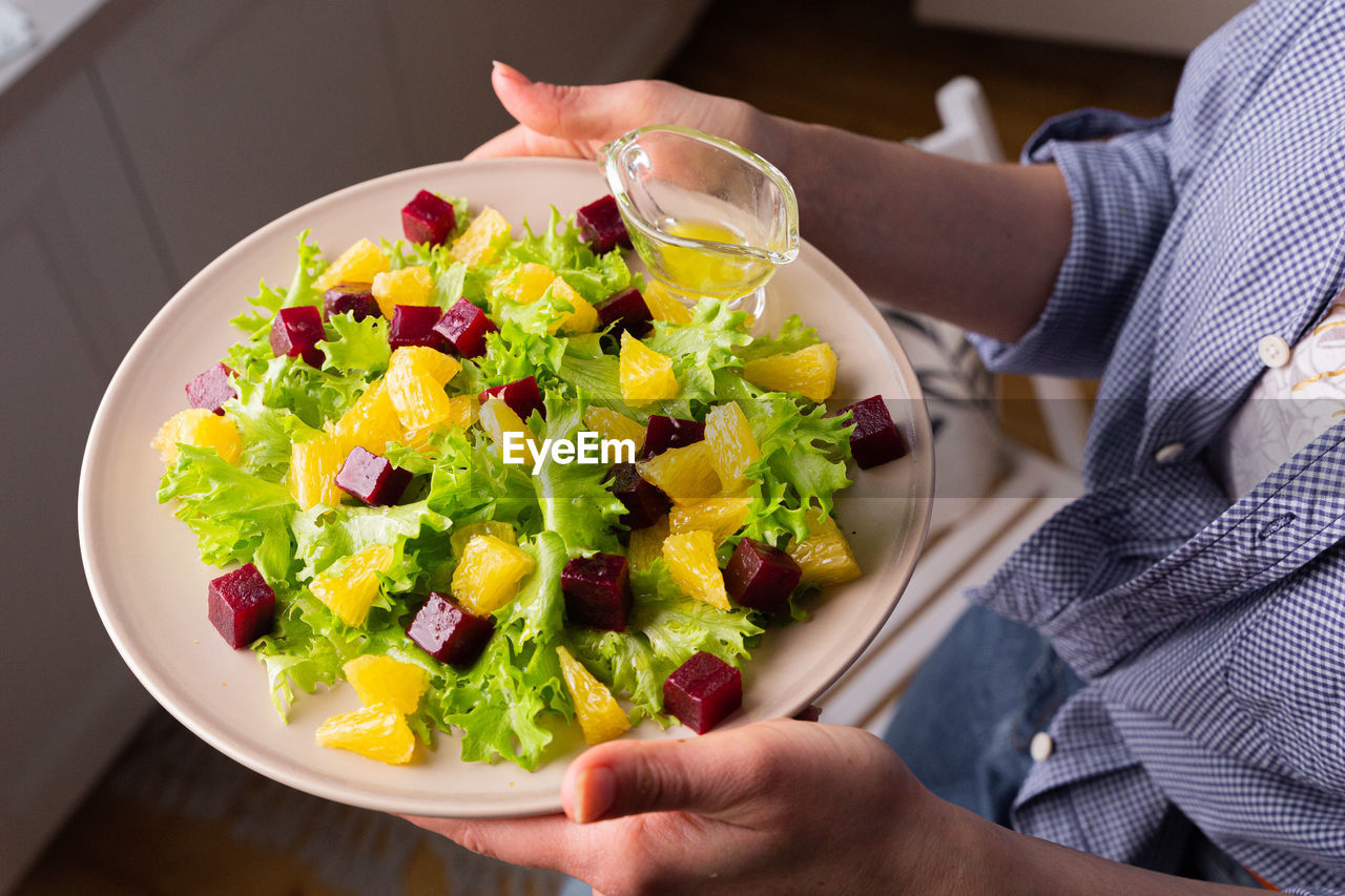 Caesar salad with copyspace on a wooden table on kitchen