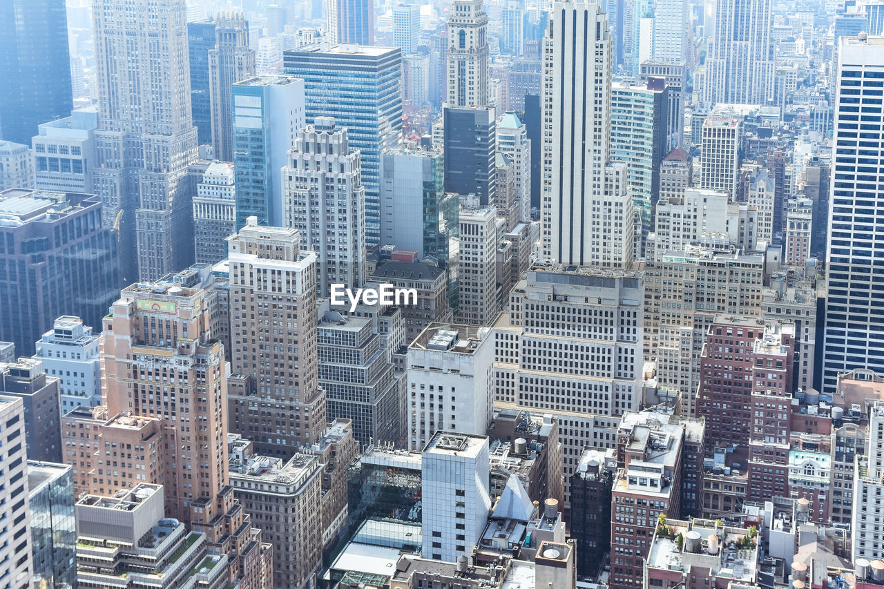 Aerial close up view of crowded buildings in new york city on a sunny day. nyc, usa.