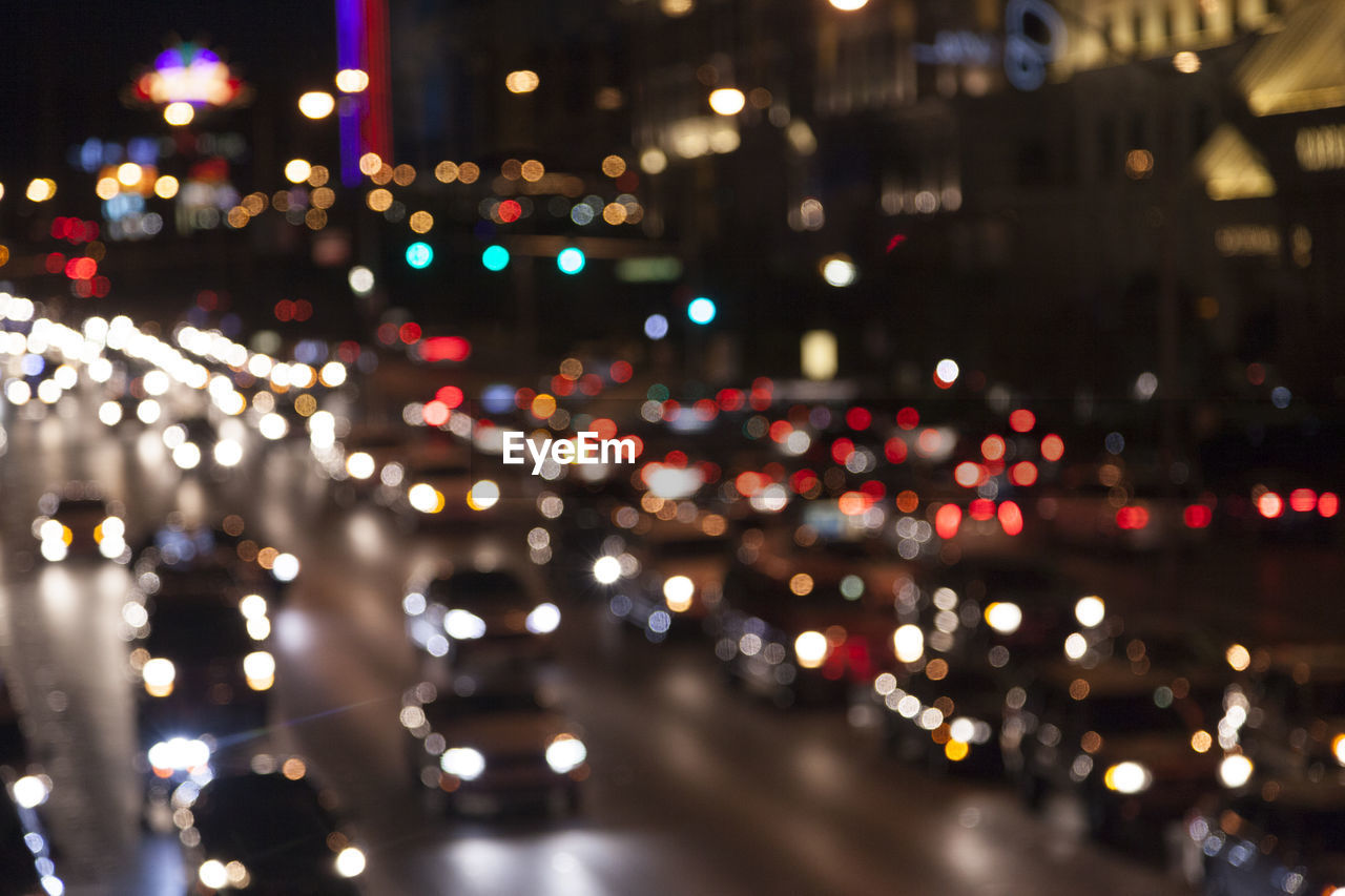 ILLUMINATED CITY STREET AT NIGHT