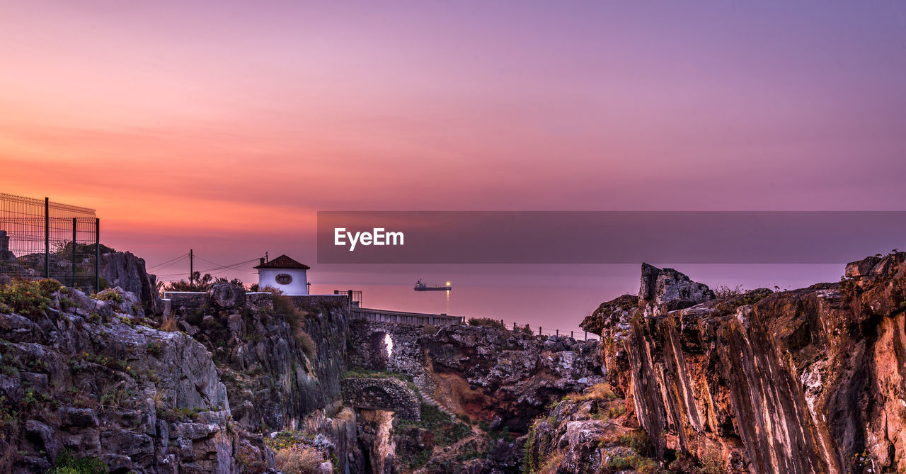 Panoramic view of sea against sky at sunset