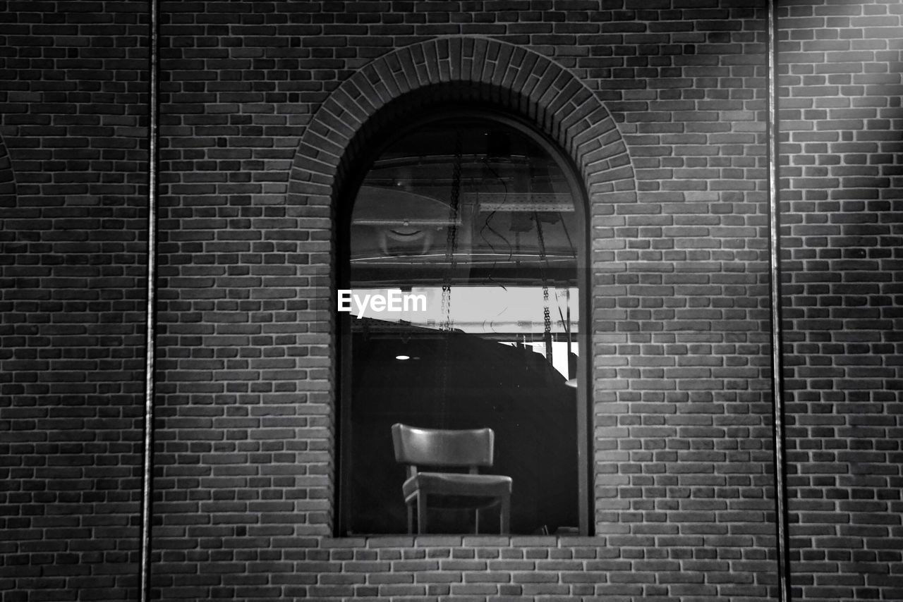 Close-up of window on brick wall