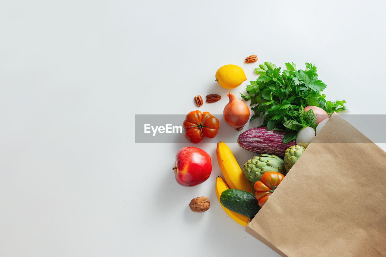 Delivery healthy food background. healthy vegan vegetarian food in paper bag vegetables and fruits.