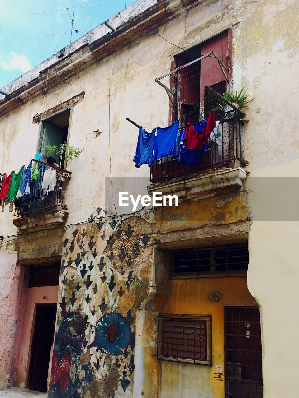 Old residential building with clothesline in balcony