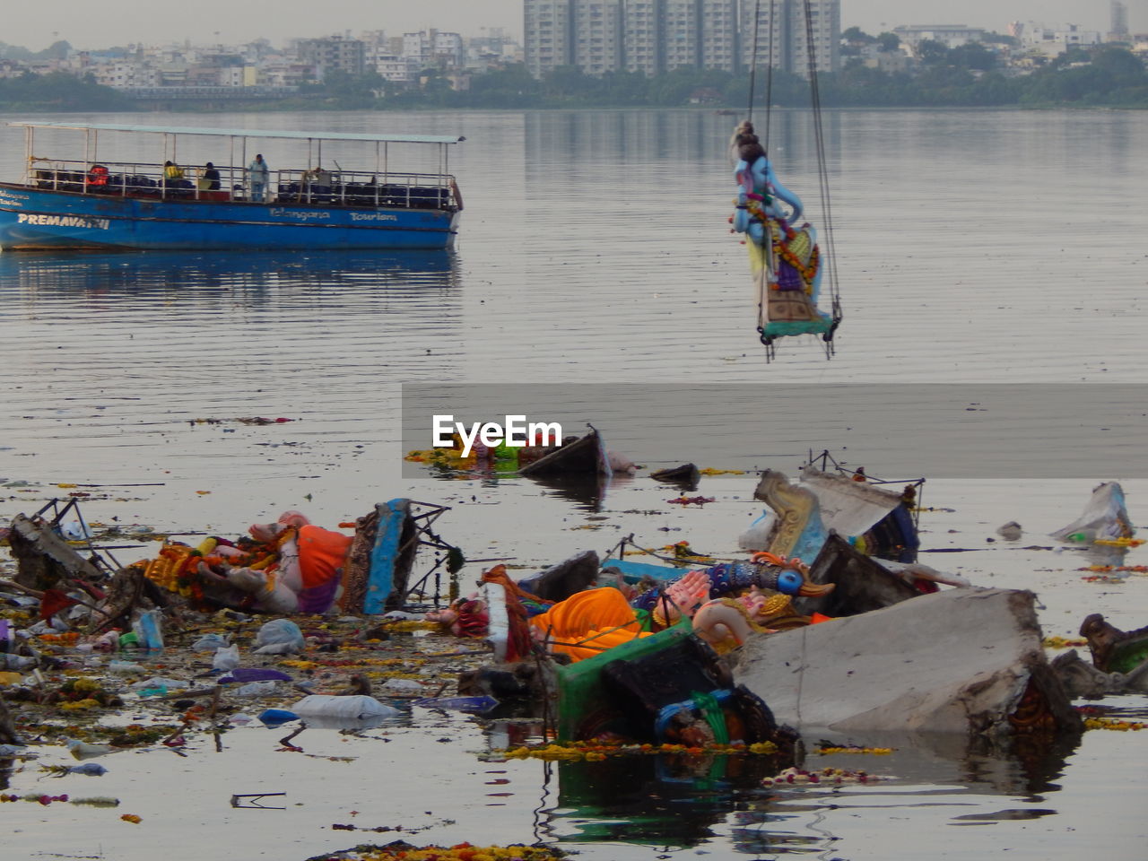 Abandoned statues and garbage in sea