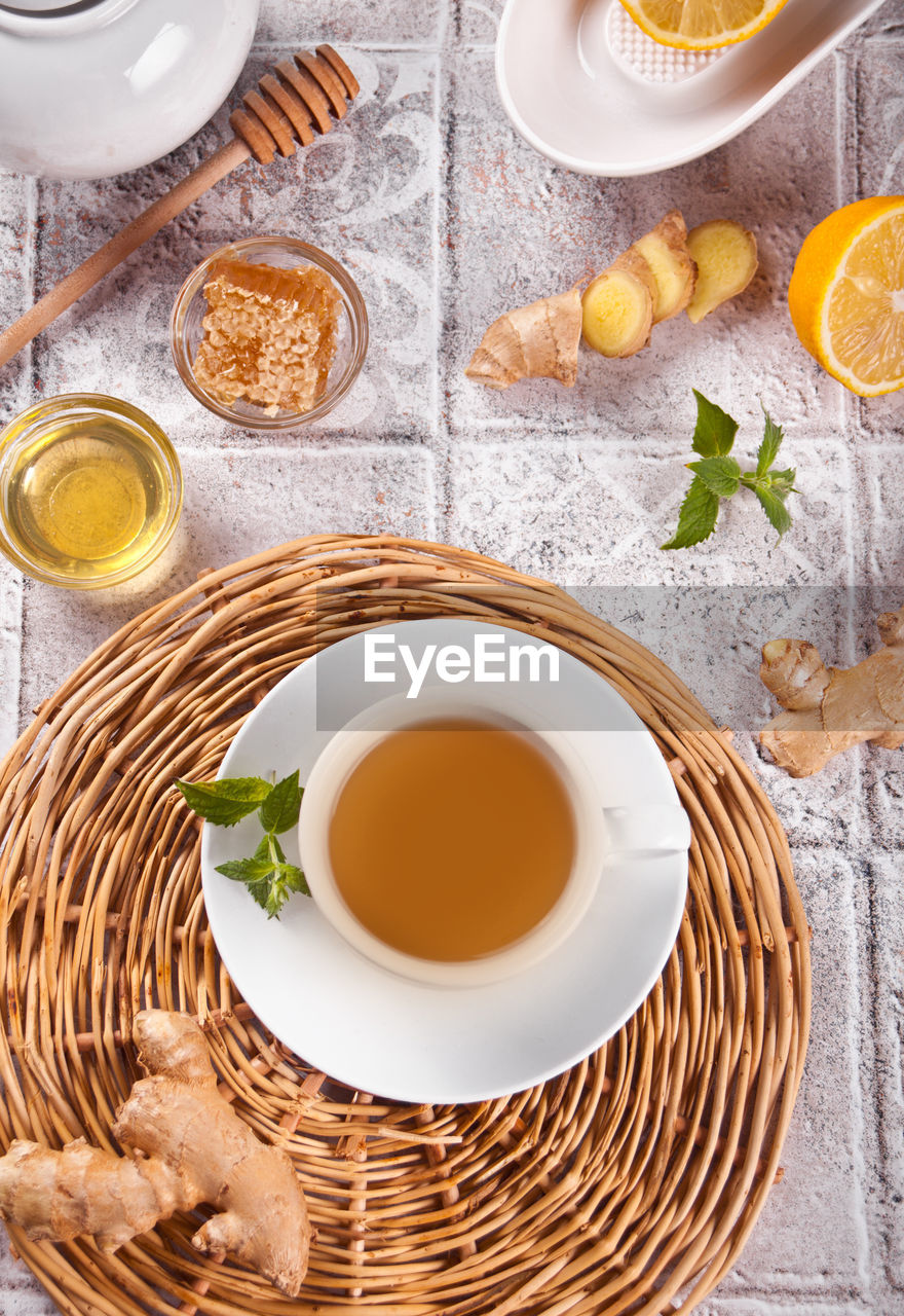 Refreshing ginger tea with lemon, mint leaf and honey