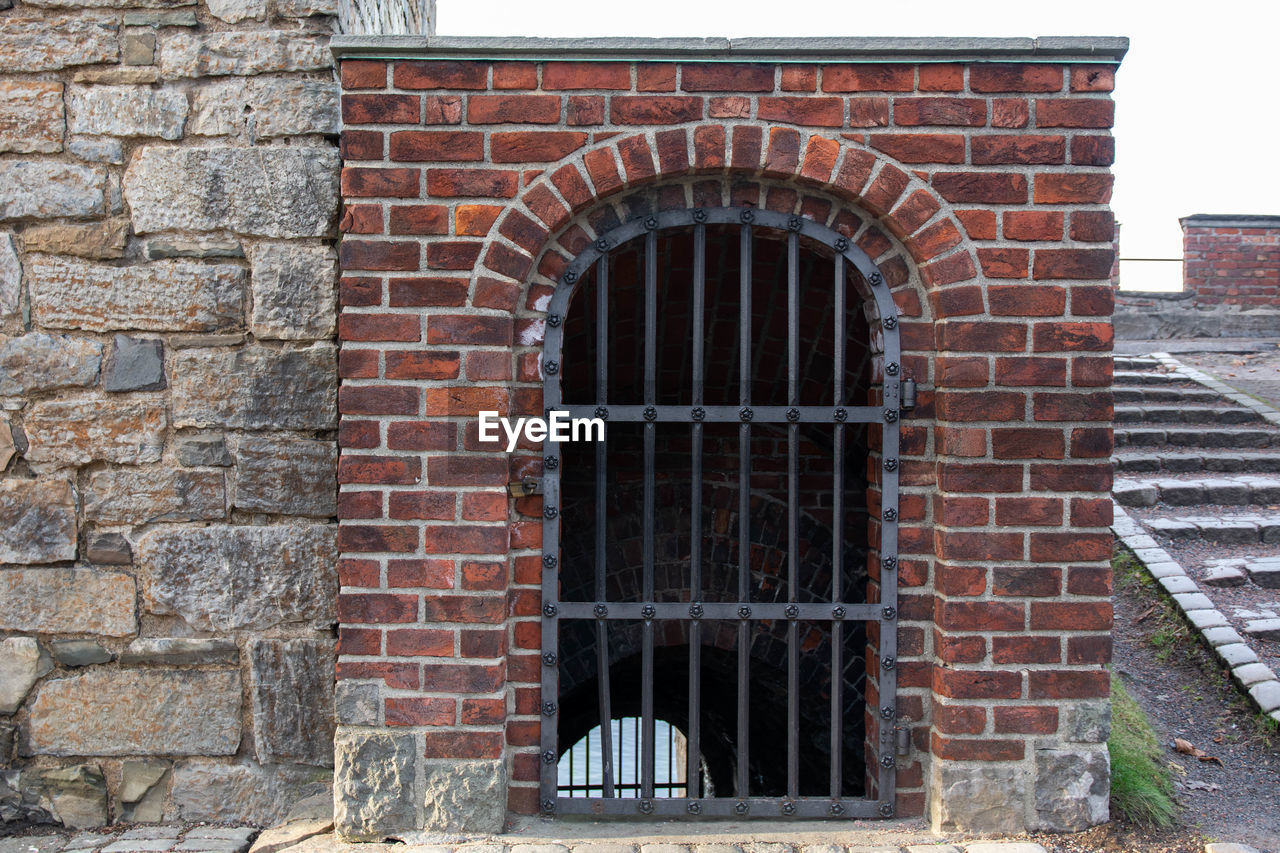 Closed door of old prison in the fortress