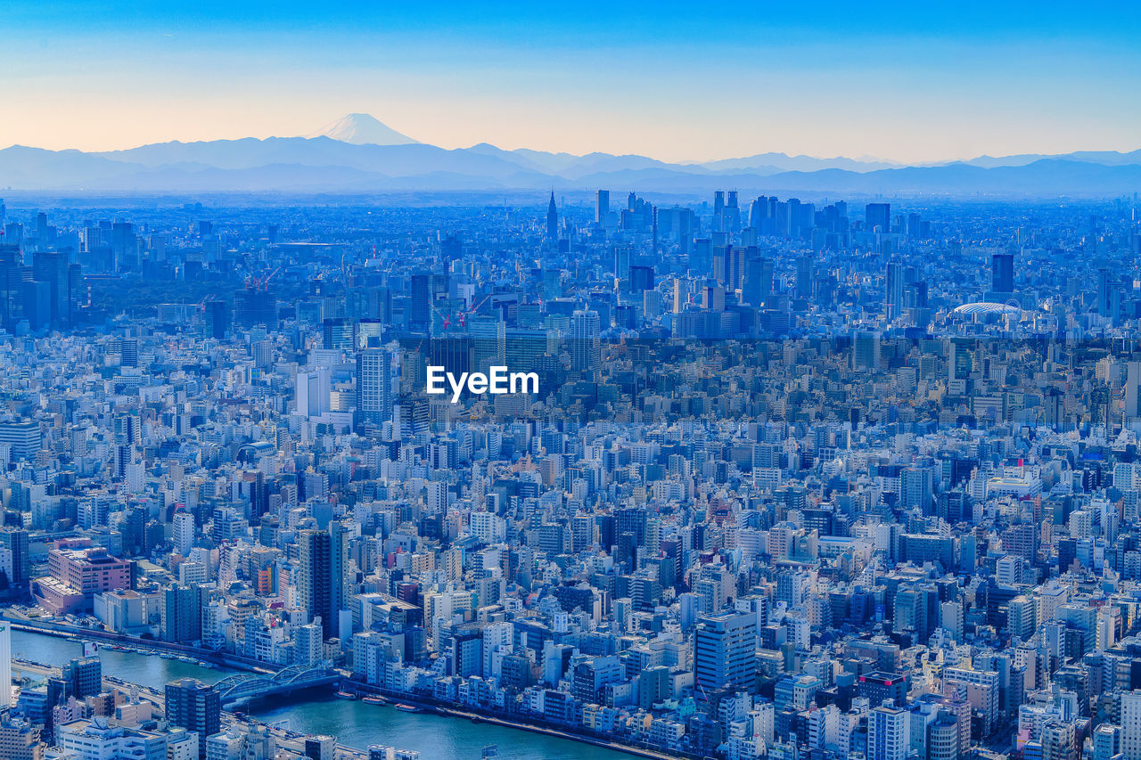 Aerial view of city buildings against sky