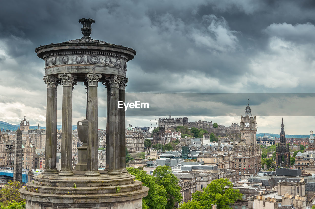 Sky with threatening clouds over the dugald stewart monument, edinburgh