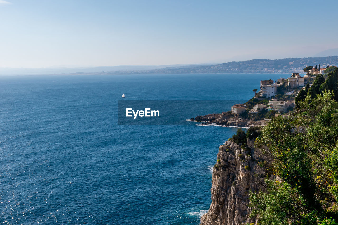 SCENIC VIEW OF SEA AGAINST BUILDINGS