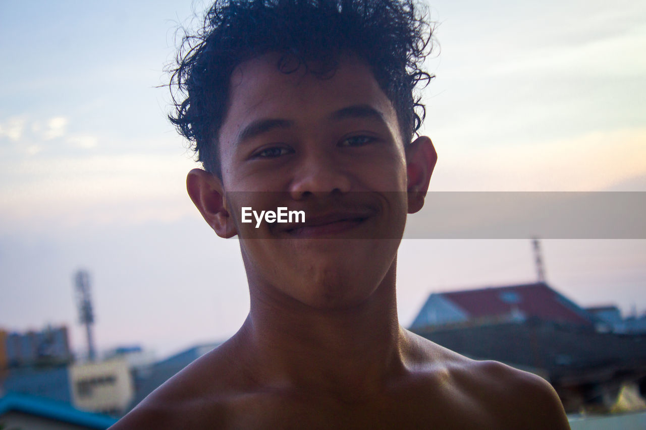 Portrait of young man smiling