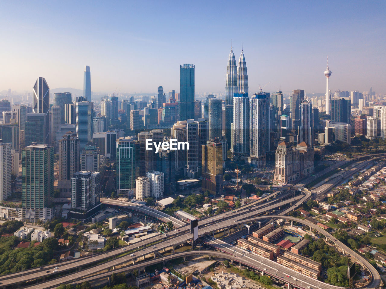 Aerial view of modern buildings in city against sky