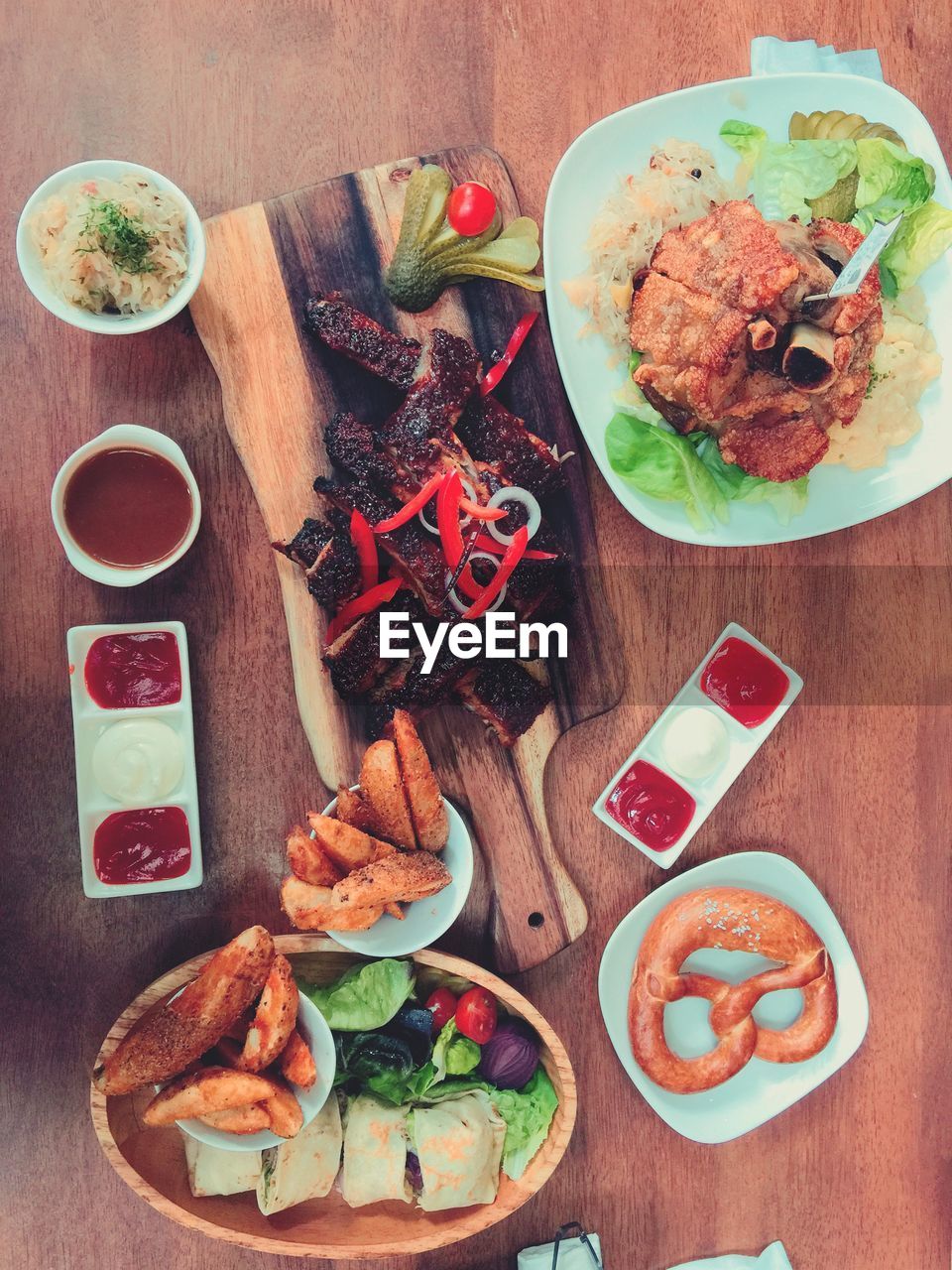 Directly above shot of food served on wooden table