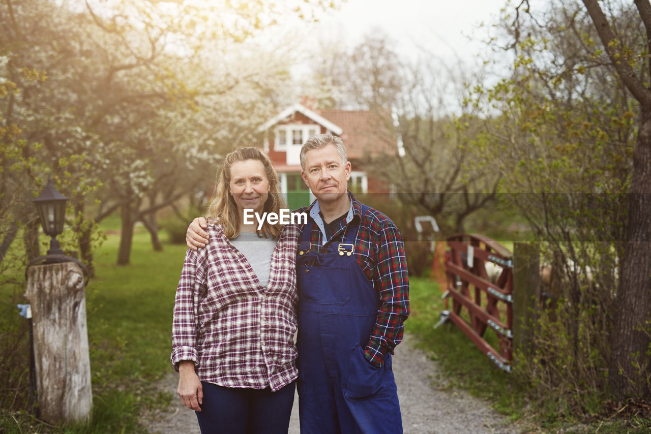 Portrait of mature couple standing on pathway