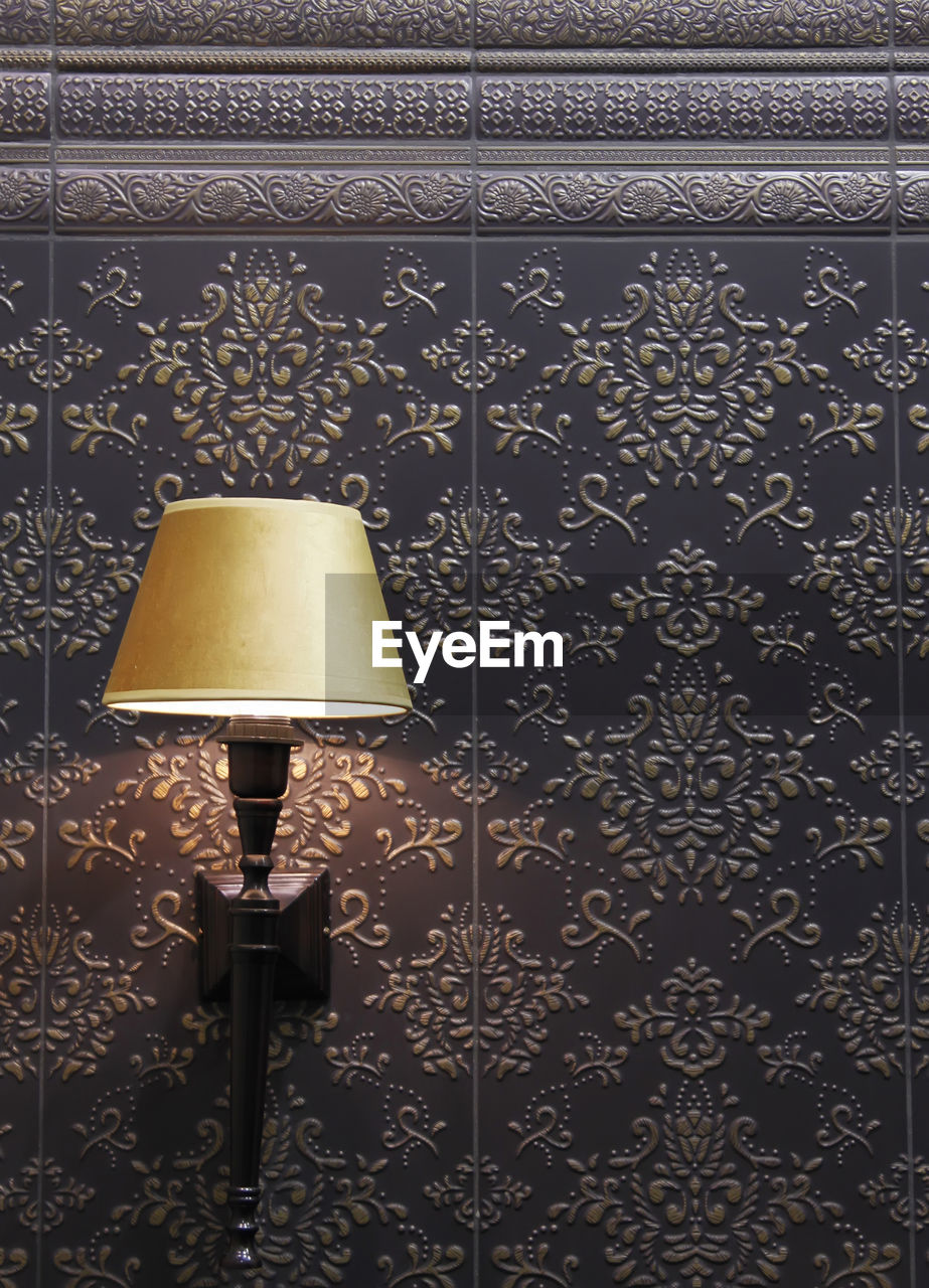 CLOSE-UP OF ILLUMINATED LAMP