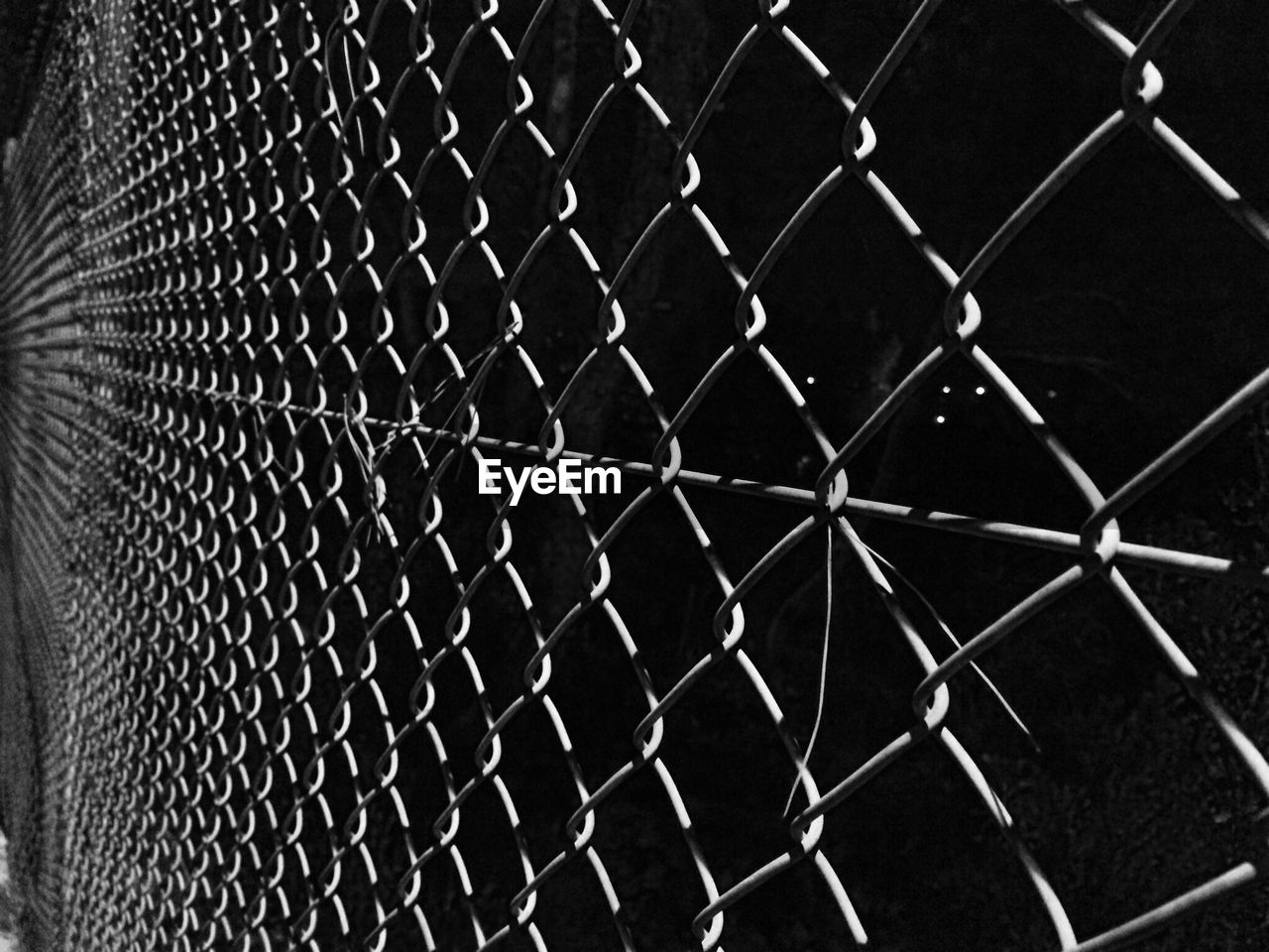 Full frame shot of chainlink fence against sky