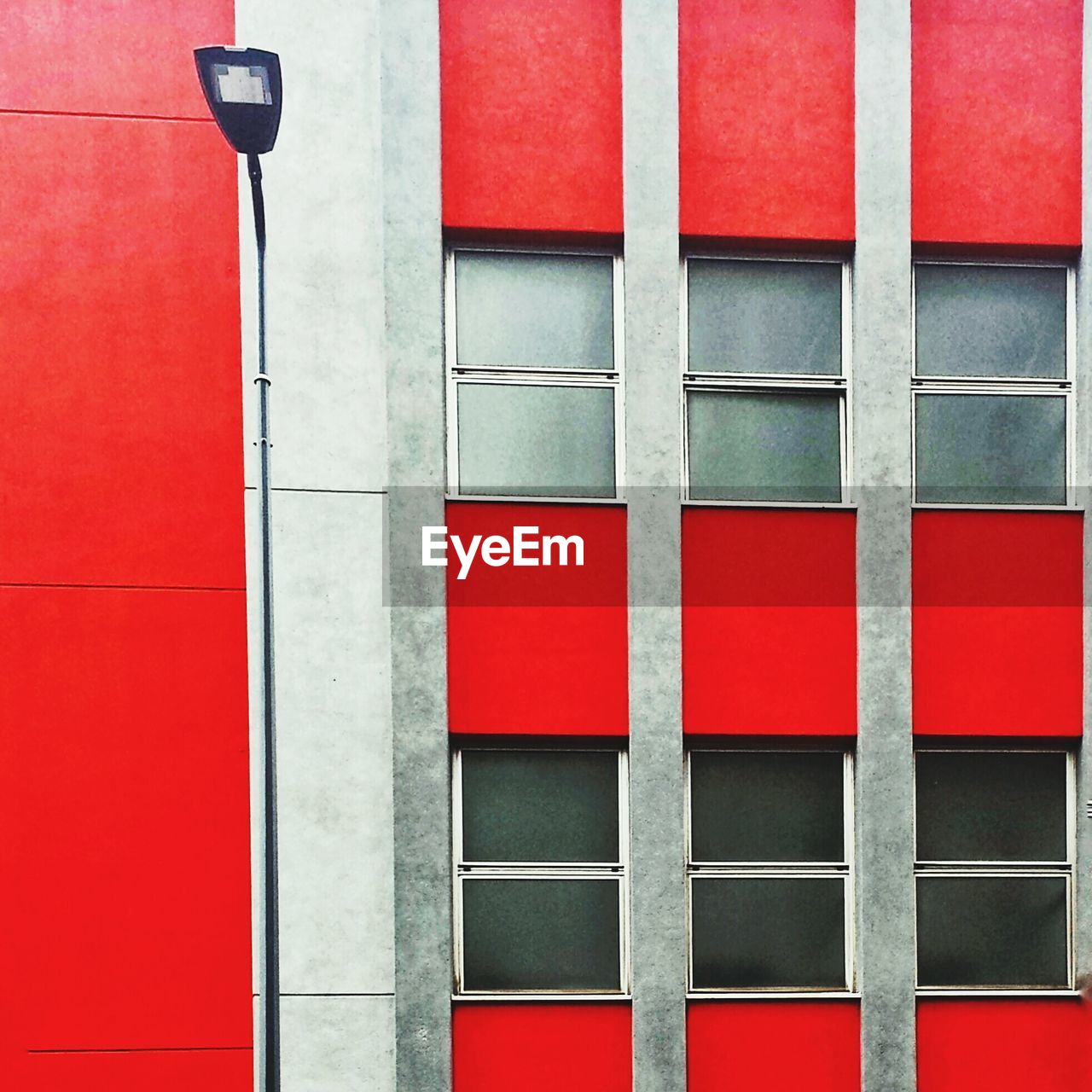 Low angle view of street light against building