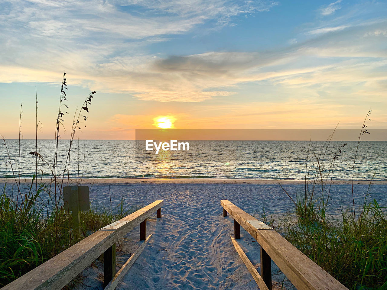 SCENIC VIEW OF SUNSET OVER SEA