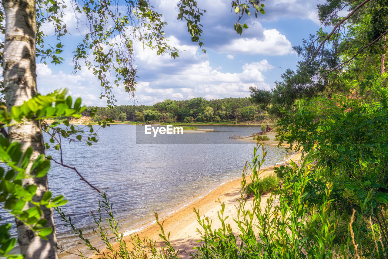 PANORAMIC VIEW OF LAKE AGAINST SKY