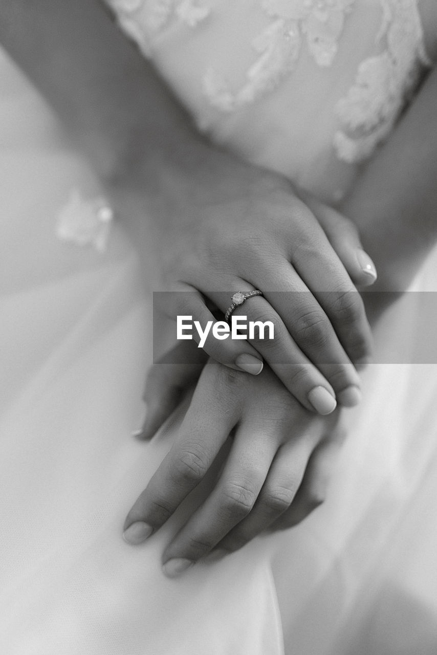 hand, black and white, women, adult, ring, wedding, love, bride, newlywed, married, jewelry, celebration, event, life events, positive emotion, wedding dress, close-up, wedding ring, monochrome photography, emotion, female, two people, togetherness, wedding ceremony, monochrome, finger, ceremony, romance, engagement ring, holding hands, white, bonding, indoors, young adult, lifestyles, men, affectionate