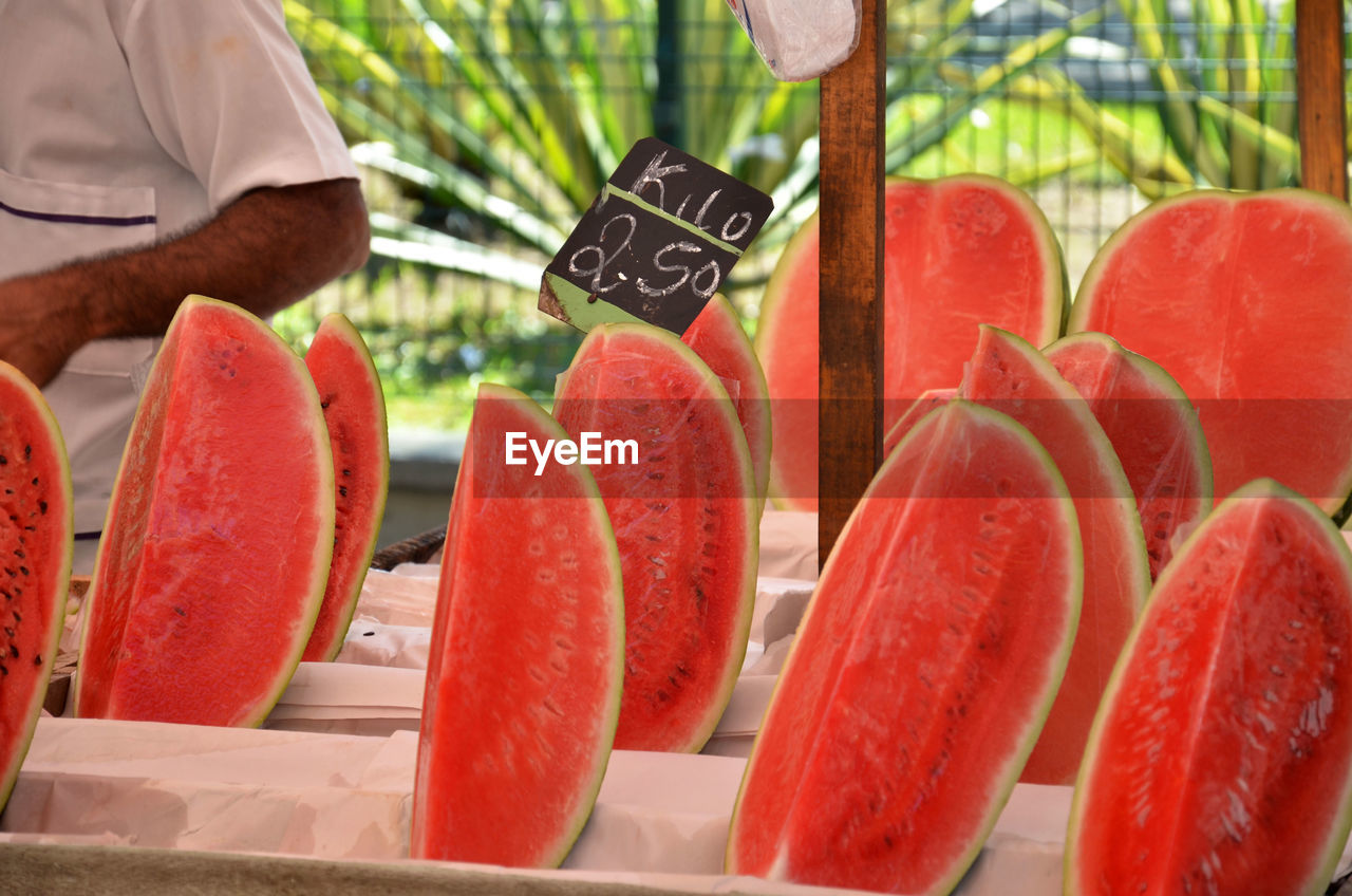 Watermelon slices at market for sale